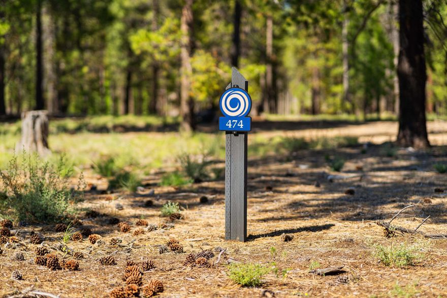 Your opportunity awaits to experience the Caldera Springs lifestyle with limited time special pricing and super incentives on select homesites. Purchase by August 31, 2025 and receive 5% off list price, Developer paid HOA dues through August 31, 2027, $10,000 Lifestyle Credit, and a $20,000 building rebate! Homesite 474 offers an idyllic blend of natural beauty amidst pine-filled landscapes and sunny skies. This lovely .51 acre lot is large enought to accomodate a 6 bedroom home. Ideally located near the newly completed Preservation Park, backs to common area, and provides a serene setting for building your custom home. Owners enjoy special access to the Forest House Amenity & Aquatic Center along with golf, fitness, pickle ball, tennis, pools, kayaks & paddle boards. Caldera Springs is located near Sunriver, just 15 minutes to Bend and 30 minutes to world class skiing at Mt. Bachelor.