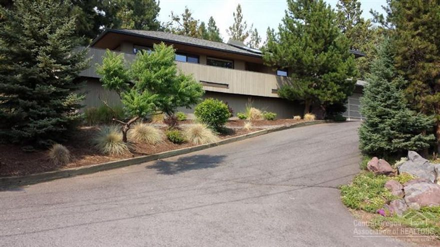 This is a Lovely West Hills home with large elevated lot, views and a great southern exposure. Convenient to all. Three bedrooms and 2 1/2 baths, 1754 square feet, .28 acre lot. Features cherry cabinets, vaulted ceilings, interior four panel doors, central air conditioning, gas Jennaire range, granite counters in kitchen, landscaping with automatic sprinklers and drip system, fenced yard. Two car attached garage. Large decks front and back of the house.