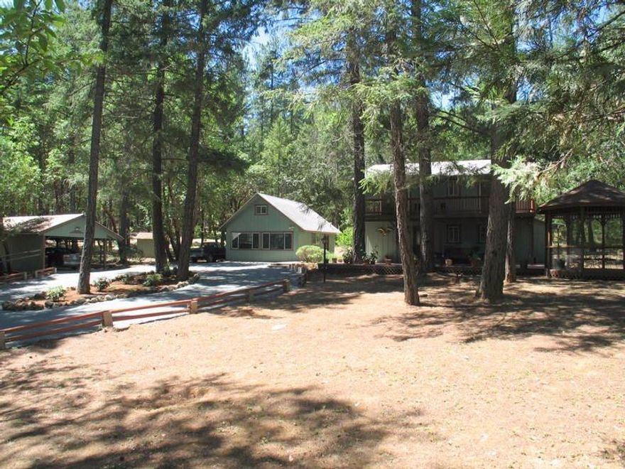 This 1,595 ranch style home sits on 4 acres in SW Oregon near the Rouge River & has been updated & turn-key ready for your arrival.Just recently replaced is new storm windows, Kitchen updated, bath-rooms, flooring & more. The home has central force heating and is very well insulated to keep you warm on those winter nights.There is a very well built 480 sq ft detached studio apartment with a half bath and a large upstairs loft for storage. The main floor is being use as a work office space at the present time but could be easily be used as an additional living space. For parking there is a well constructed framed carport with an attached 16x9 ft workshop. The property surrounding the house is nicely landscape & has a developed spring within close location to the home also a seasonal creek with a large gazebo to take a break from the summer weather. Why wait? Schedule an appointment today to see this special property, very easy to show.