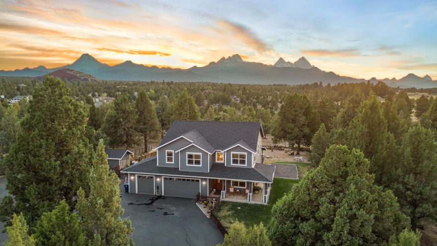 Close in acreage w/Cascade Mountain views in the sought-after Sundance neighborhood. This almost 5 acre property offers the perfect balance of privacy & convenience, with Caldera High & Alpenglow Park just 4 miles away, Costco 8 miles & the vibrant Old Mill district only 10 miles away.
Spacious gourmet kitchen that flows into the dining area & expansive great room. Generous proportions of this space ensure that all your entertaining needs are met. The spacious office & full bath on the main floor provide convenience for guests or a home-based business.
Ample storage, including a 24'X40' shop with a wood stove, multiple parking areas, RV hook-up & dump, cater to your storage & rec. needs. For horse enthusiasts, there's a loafing shed & tack room. Imagine going for a ride right out your doorstep. Don't miss the opportunity to embrace a lifestyle that combines serenity w/access to modern amenities. Inquire today about the 2.5% Seller's assumable loan!