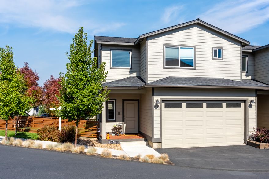 With a new price of $489,988 this home just got better!  All new stainless steel appliances and beautiful finishes throughout the home.
Gorgeous move-in ready 3 bedroom, 2.5 bath condo located a short distance to local grocers, food carts, shopping & medical facilities! Less than 4 years old this condo has been very lightly lived in and offers a beautiful yard & deck space, perfect for entertaining guests or growing your own vegetable garden.
Through the front door, you will find the great room, with a gas fireplace and tons of natural light open to the kitchen that features pantry cabinetry for additional storage. slate grey, quartz countertops with a large island & vinyl plank flooring. Upstairs you will find the primary suite two additional bedrooms and a loft flex space. The community dues cover water, sewer, garbage, landscaping and snow removal making this an easy second home or fantastic investment property.