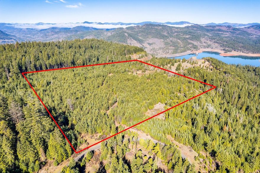 Incredible opportunity to build a dream home overlooking Southern Oregon's Lost Creek Lake.  This 40-acre homesite is the ideal off-grid, private retreat, being located behind a locked gate and bordered on two sides by federal land.  Rocked roads lead into the property and through the trees to the cleared homesite with breathtaking views.  A well has been dug and a septic system has been installed.  The terrain is flat and gentle and the majority of the land is tree covered with plenty of room to explore.  Wildlife is abundant in the area and includes deer, elk, bear and turkey to name a few.  Enjoy all of this while being minutes from the Rogue River, Lost Creek Lake and Joseph Stewart State Park.  Shady Cove is just 15 minutes away and Medford just 45.  Buyers to conduct their due diligence in regards to all aspects and uses of property.