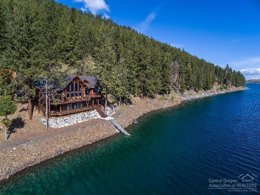 Beautiful custom log sided home right on Wallowa Lake with private dock & lake access on 4 lake front lots. Attention to detail in every room, open main level plan with sunken great room overlooking the lake, expansive decking, family room with wet bar on lower level, detached garage with plenty of room for boats, ATVs, & plenty of storage. Ask a REALTOR for ebook & additional list of amenities.