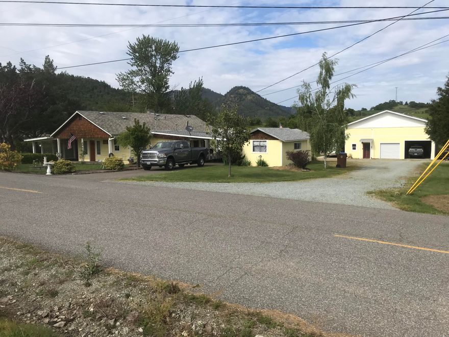 HUGE price drop! 2 places in 1. Front home is improved 1947 w/2 bdrms & full bath.Some ADA features in kitchen and bath, wider halls and doorways. New paint, new ductless heat. Living rm wall is plumbed for gas heat. Dining area, kitchen w/ storage. Huge Primary. Bath has lg jacuzzi tub/shower.Laundry/mud rm, multiple parking incl 2 covered areas,& lg storage structure, patios. 2nd bldg is lg garage for w/ loft storage. Attached covered RV w/ hookup/dump station & another on left side. On left is attached Barnominium w/2000+ sq ft! Living area, upscale kitchen with island for 5+w/storage ,pantry, Corian counters. Office area, lg bedroom, full bath w/tile shower, laundry w/utility sink. Upper loft area for addl guests.  Dividable property approved for buyer to complete which will allow ADU permit. Sell 2nd section, use as 2nd dwelling, income/multi family property once ADU use is approved. Without permit apply for med hardship as is. Ask for amenities write up for more details and doc