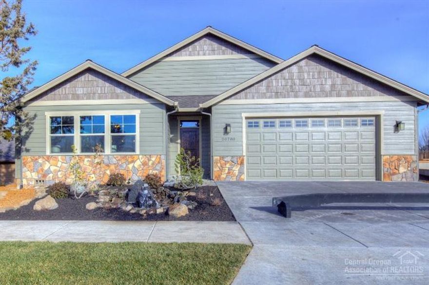 This is it! Spacious single level living, fantastic design to capture natural light w/ great southern exposure & Cascade Mountain views! Situated on a quiet dead-end street, enjoy low maintenance landscaping w/ beautiful water feature, unobstructed Mt. Bachelor & Pilot Butte views, functional open concept floor plan, solid wood floors, slab granite counters, & custom tile shower w/ zero threshold entrance. Don't miss this truly hard to find newly constructed home on Bend's NE side.