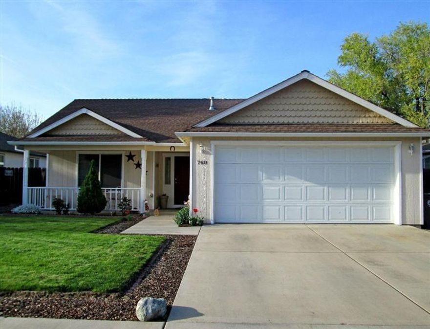 Delightful home in SW Medford. From the sweet front porch, enter into the charming comfortable interior splashed with warm inviting colors. Tile counters in open kitchen, island with breakfast bar & pantry. Private master suite with vaulted ceiling and walk-in closet. Large covered patio off the dining area. Spacious fenced backyard.