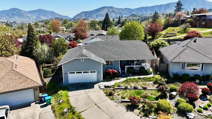 This is a lovely home in a great neighborhood! Enjoy the beautiful views from the covered front porch or enjoy privacy and tons of mature greenery including grapes and blackberries around back! 3 bedroom 2 full bath with a great sized kitchen/dining area. Nearby schools and shopping are super convenient! recently replaced roof and HVAC. 1 year home warranty offered for full price offer. Won't last long!