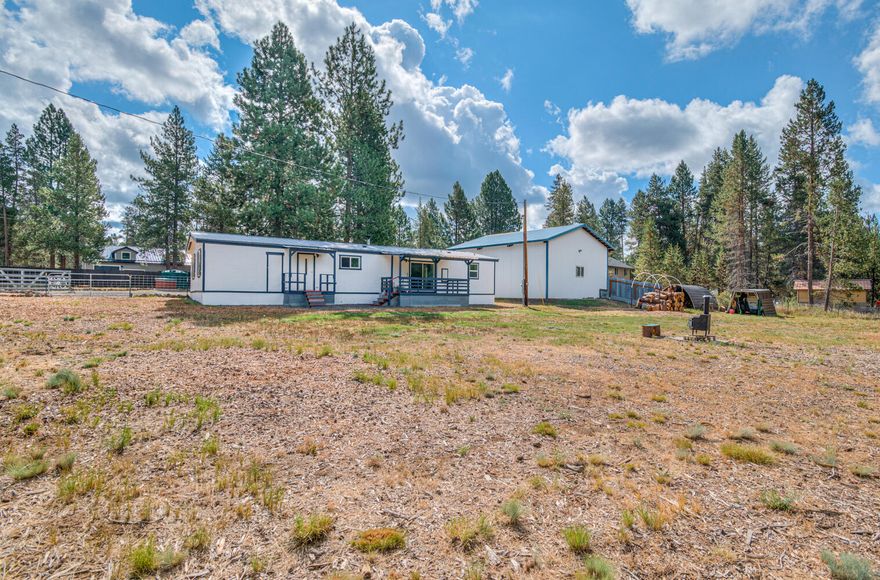 Nestled on 1.03 acres in the heart of Central Oregon's coveted 97707 area, this 1978, 3-bedroom, 2-bath manufactured home offers endless potential and a location that can't be beat. A spacious turnaround  driveway welcomes you in, making access easy for guests, trailers, and RV's. The impressive 36x36 shop is perfect for hobbies, storage, or workspace, while the dedicated RV parking adds even more convenience. Surrounded by towering pines and just minutes from the Deschutes River, Sunriver, and miles of outdoor recreation, this property combines space, functionality and the unmatched lifestyle Central Oregon is known for. Whether you're looking to update and make it your own or simply enjoy the setting as it is, this is a rare find in an incredible location.