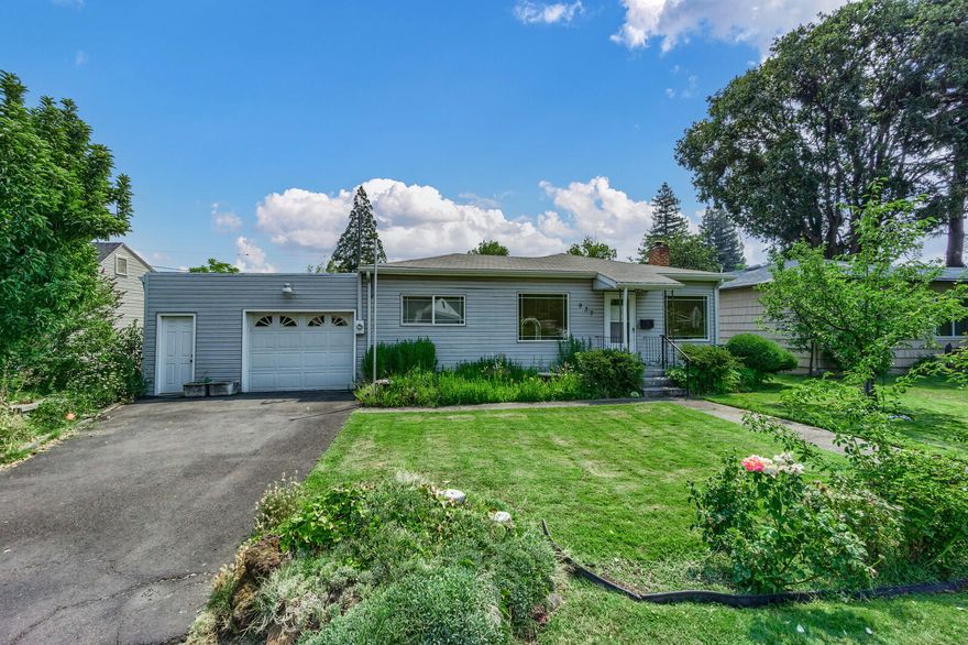 This home is ready for your personal touch! Nice-size living room with a wood burning fireplace. Lovely natural light flows through the windows. Kitchen has an eating bar with 2 bar stools that looks out to the pretty front yard and a stainless-steel appliance package including dishwasher, range/oven and fridge. There is also a bonus room that could be office or den.  This home has a newer HVAC system, several updated vinyl windows and lots of storage. The garage is quite large with a single roll up door and a man door. County shows garage is 464 sqft. There are 2 closets off the back of garage for storage. The backyard is large and lush! Newer sprinkler system that keeps the lawns green! Cute patio for outdoor entertaining! What a great opportunity!
