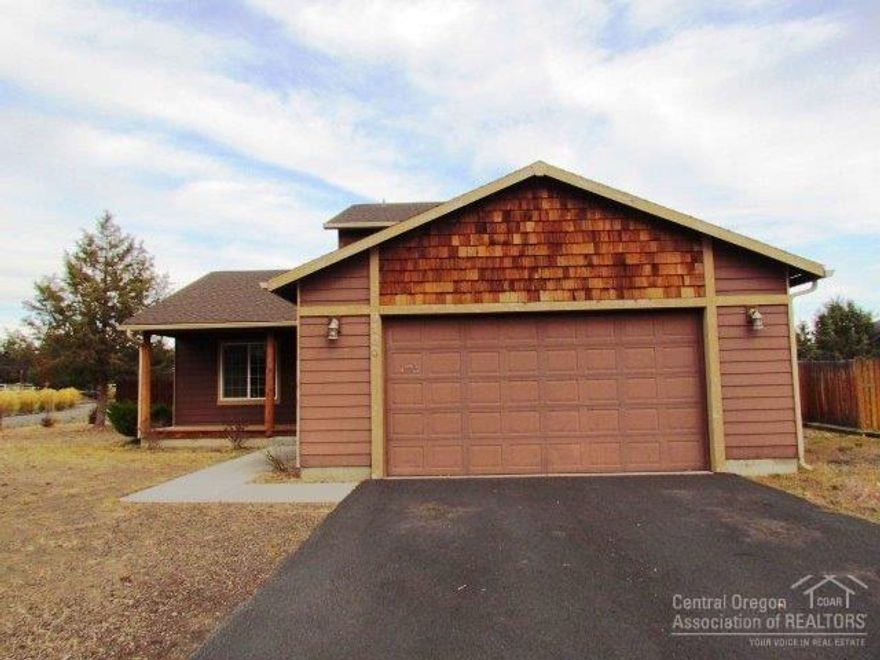 Nice neighborhood and convenient location on a large corner lot with RV parking. Features vaulted ceilings, natural wood trim throughout, master bedroom on the main level with bathroom soaking tub, double vanity and separate shower, large fenced back yard and more.