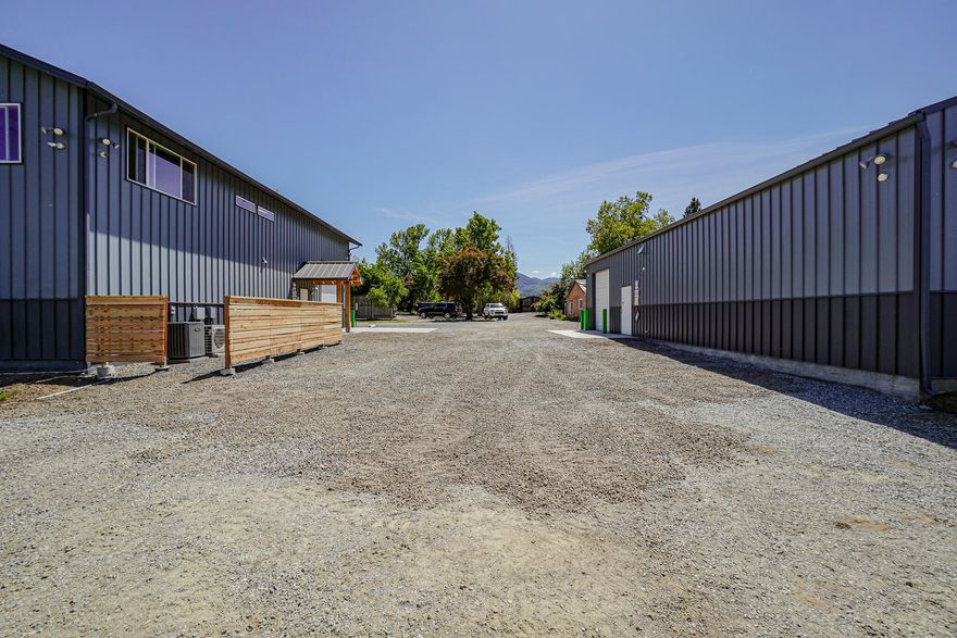 Hard to find! 4 Legal buildable Parcels with 22.02 acres with individual addresses all zoned EFU w/ TID irrigation rights & pond & an 80 Gallon a minute well! Two custom built buildings on the property with one being a county approved 3600 sqft high end commercial building with commercial kitchen, tons of upgrades, compressed air, and fully networked w/ security. Building 2 2400Sqft Ag building with 400 amps and is insulated for energy efficiency and is ready! Just a few of the upgrades, permitted 8' fencing, 4500 gallon holding tanks, drip systems, private offices, power everywhere, gas endless hot water heater, 2 gas furnace heaters /AC and much more. Please reach out to the listing agent for asset list and all details. Too much to list. Option to possible owner carry.