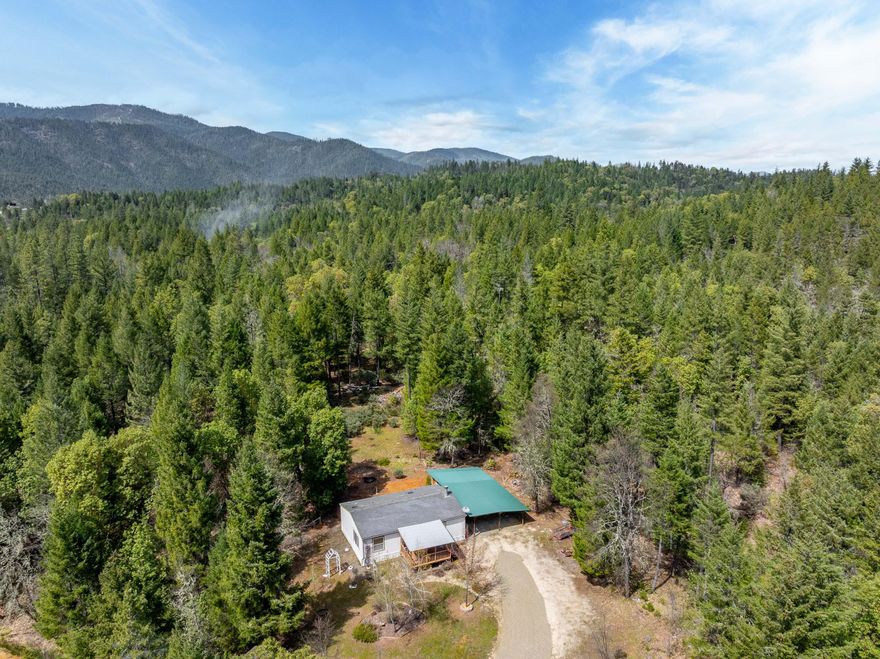 Charming 2-bed, 2-bath home on 20 private acres with room to grow! Features include a second homesite on a knoll overlooking 5 acres of pasture, with a driveway and power already run to it, a chicken coop with water and electric, covered 2,000-gallon water tank, and excellent-tasting water. Storage room off the carport and Rubbermaid shed included. All appliances included! A great opportunity to enjoy peaceful living with usable land and plenty of potential.