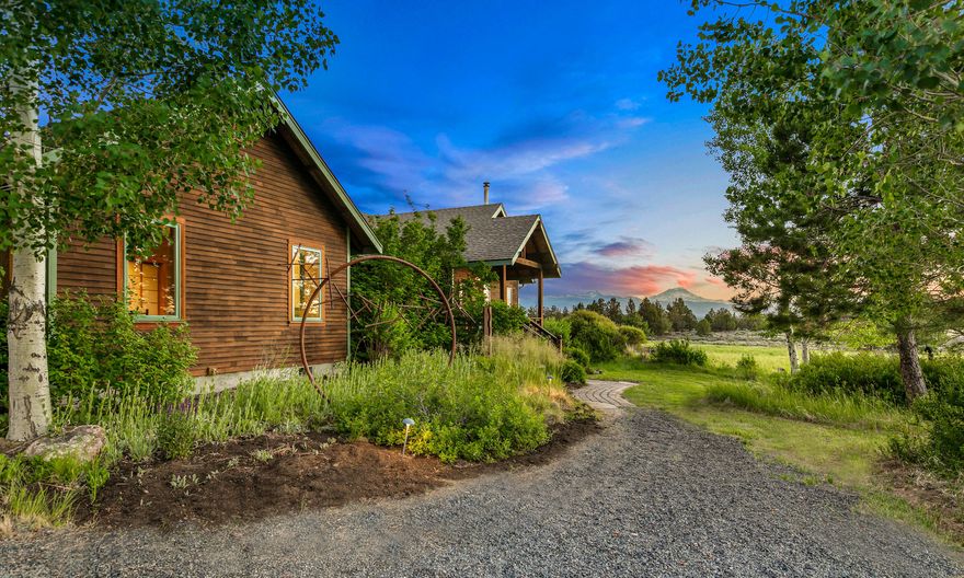 Magical Tumalo property with magnificent views. Come see this perfectly located 9.7 acres (6.1 irrigated acres) and charming 3 bed, 2 bath 1,877 square foot home that takes advantage of the cascade mountain views and spectacular serene location. This comfortable artist designed home features wood floors and granite countertops with many creative details. Enjoy the  private garden with fire pit, or the larger flower garden and outdoor gathering space. There are two barn/studios with loads of natural light, vaulted ceilings glass roll-up doors and beautiful views. This property is truly special, and features the incredible privacy and stunning views that Tumalo is known for with access to public land and trails right next door. Don't miss your chance to own this Tumalo Masterpiece.