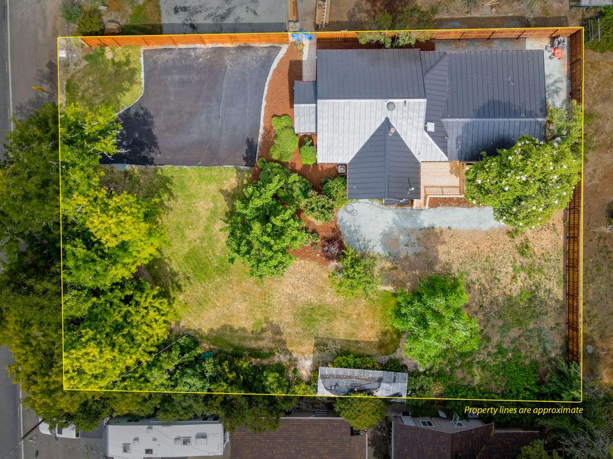 Vintage charm with all of the modern amenities, on a huge lot with mature landscaping! This single level 1,448 SF home is full of recent updates including: New Metal Roof, new exterior paint, updated windows, flooring, and lighting. Outside, you will find a brand new paved driveway, privacy fence, and more on this 0.31 acre lot. There is nothing to do but move in! This quiet  neighborhood gives this 3 bedroom, 2 bath home a wonderful setting. This property is just minutes from shopping, schools, Fruitdale Park, and the Rogue River! Call for your tour today!