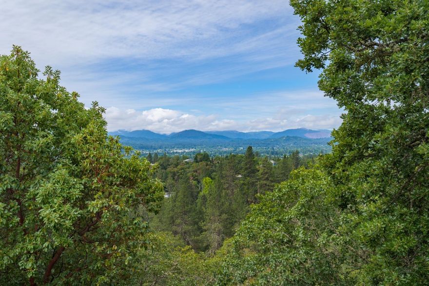 Spectacular view parcel in one Grants Pass' most desirable neighborhoods set high above the city. This hillside lot features gorgeous long-range views to the West of the surrounding mountains and valley below that deliver amazing sunsets. Close to town with District 7 schools. Bring your builder and start designing your custom home today!