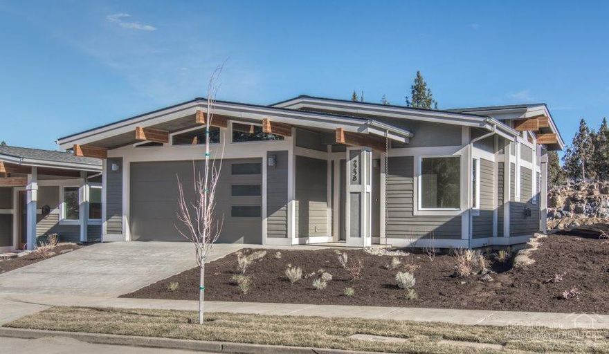 Arbor Builders Lakeside Place includes new homes in a quiet Northwest Bend location, just 1/4 mile from river trail access and walking distance to downtown Bend. The homes feature Frank Lloyd Wright's modern styles. This single level Mid Century modern style home features high end finishes as standard, including hardwood floors, stainless steel appliances, tile counters, Earth Advantage new home certification, and AC and solar ready. Lots of natural light and inviting patio spaces. Photos of a similar home