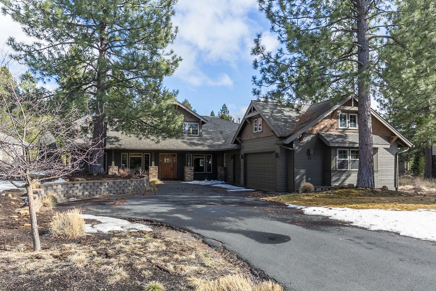 11 Dogleg is a large lodge-style home with a welcoming and warm design. Featuring 4 bedroom suites, and an office, which could easily be a 5th bedroom. Upon entering the home you have the office to your left and the dining room to your right, The dining room opens to the great room and kitchen. The great room has the feel of a lodge with its towering tongue and groove ceiling and floor-to-ceiling rock fireplace. You won't need a thing in the large kitchen with a double oven, breakfast bar, tons of counter space, and stainless appliances. The main primary bedroom is located downstairs with patio access. Three additional bedrooms are upstairs. Outside you will find, covered seating area, a hot tub, and a paver patio that wraps around the back of the house. 660 SF of bonus space above the garage is included in the square footage. Dogleg Lane is located at the north end of Sunriver near the Benham Falls Trail, Sunriver Owners Pool, and the Woodlands Golf course.