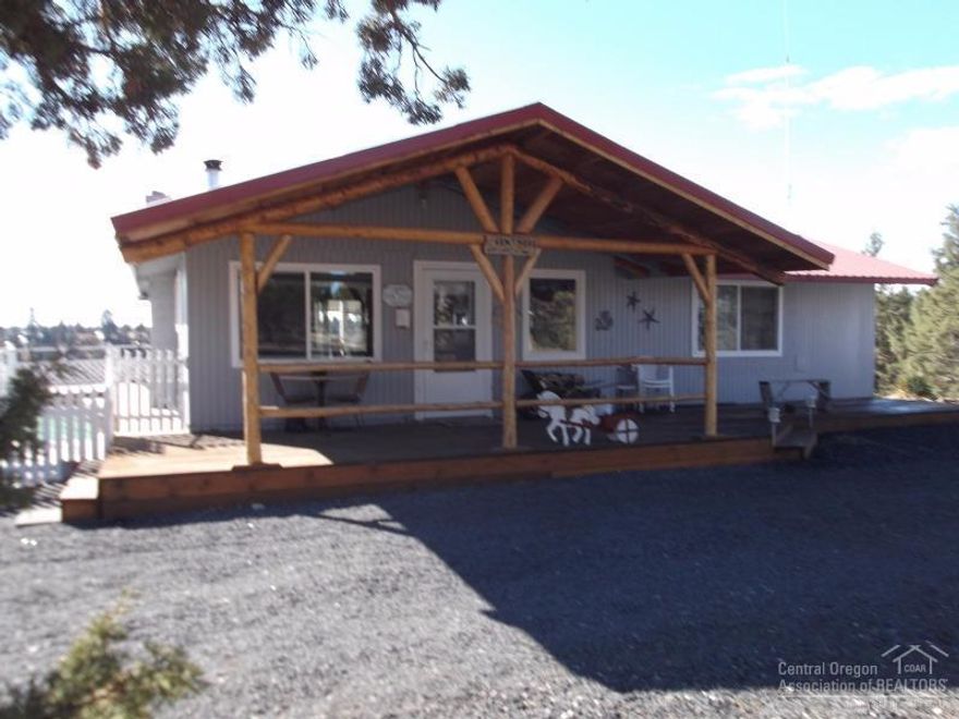 Vacation property located in 3 Rivers on Lake Billy Chinook. Great cabin fully equipped and move-in ready with custom kitchen, new lam throughout, good solar system with generator back-up, covered porch, covered outdoor kitchen area, 2 water tanks, 3 RV hook-ups, and fabulous views from this corner lot. Tons of storage for all your toys. Owner will carry a contract.