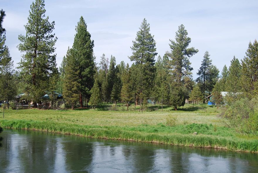 Best price for a buildable Big Deschutes River homesite with a view of the water.  0.58 acre level lot with mature Ponderosa Pines for summer shade.  Private setting on a quiet lane and 2 minutes from the kayak launch site.  Cross the bridge and hit the trails in the LaPine State Park.  25 miles of boatable water right out back.  Everything you are looking for in a Deschutes River dream site.