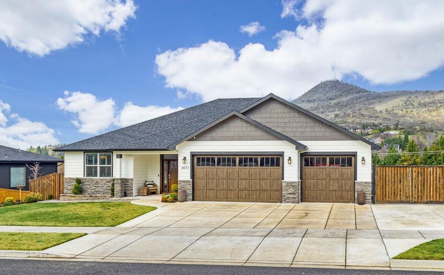 A beautiful home in East Medford with incredible views of Roxy Ann. Built in 2018 this property has four bedrooms, two full baths, two half baths, 2919 total square feet, and on a good sized .24 acre lot. This home has a gourmet kitchen, all new custom cabinets, granite and quartz counters and a fabulous master suite, with a large walk-in closet, all on the main level. It is a great open floor plan with a lovely living room and dining area that opens out to the spacious deck, plus a great family room downstairs, with bar area, plus two large bedrooms. There are ship lap accents, newer flooring throughout, beautiful built-ins and room to entertain family and friends. There is a three-car garage, RV/Boat parking behind the gate and it is located in a great neighborhood with sought after schools. A must tour property!