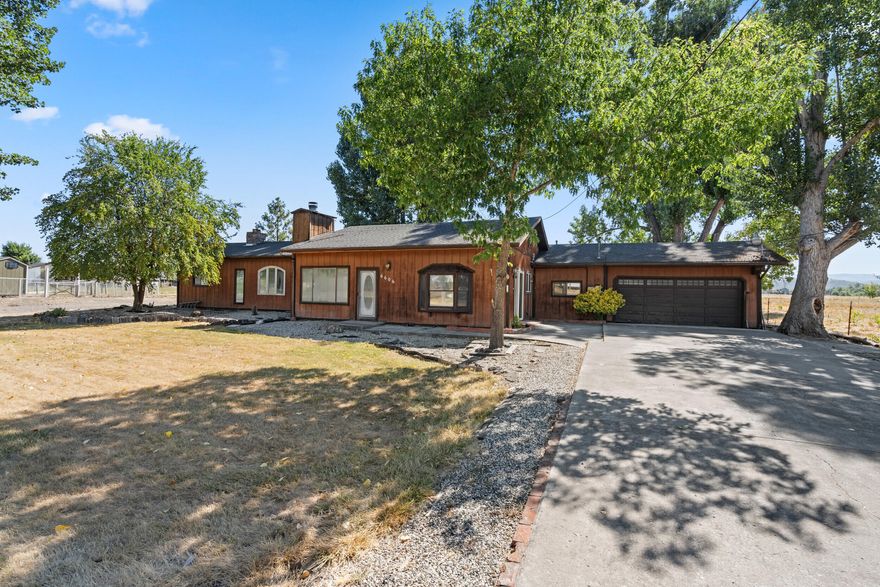 *Multiple offers, highest and best offers are due 8/14/25 at 5:00PM. * What an incredible deal! No comparable property in the MLS within a 5 mile radius has sold for this price since 2017! Flat, useable small acreage on the outskirts of Central Point. Two driveways leaves plenty of room for RVs, boat, toys, and work equipment. The home has living room + family room. Kitchen with some very cool masonry. Primary has its own bath with soak tub and a 2nd vanity. Special home and one of a kind. Public sewer system. Offers will be entertained after property has been exposed on the MLS for 7 calendar days. See Instructions.