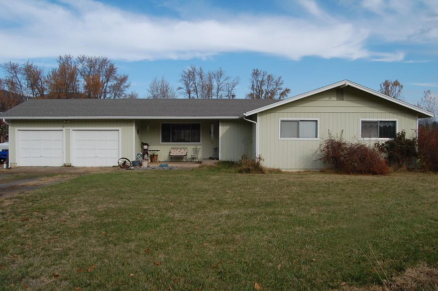 Nearly 30 acres of flat land/10 acres flood irrigated from irrigation ditch, approx 12x32 pond, large loft barn with a 3bay/32x32 overhang, and on the sides, high producing well, home was built in 1977, has 3 bedrooms, 2 baths, large living room, heat pump installed around 2008.  They use to run cattle on the property, averaged around 650 bales of hay, some of the pasture now has berry vines on it and get approximately 350 bales now.
