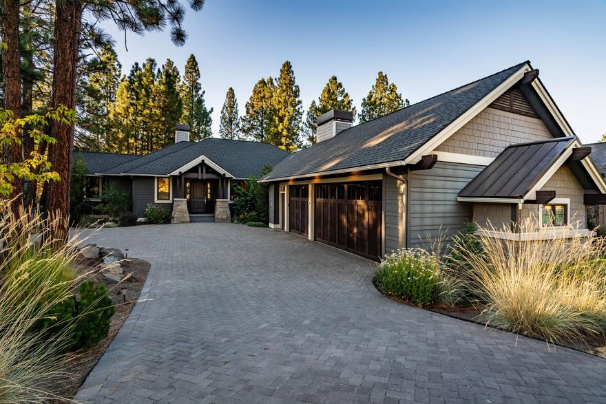 Fabulously located in the highly sought after Reserve at Broken Top neighborhood, this spacious home has it all. With trail access to the Phil's Trail complex out your back door, you'll enjoy the convenience and close proximity to the NW Crossing area shops, restaurant & schools. This beautiful home on just over a 1/4 acre lot with designer selections throughout features an open vaulted great room design, chef's island kitchen with floor to ceiling cabinets & marble counter tops, dual master suites on the main floor, double glass door den/office off the entry, and a large entertaining deck looking out to the mature pines. The lower level leads to a large family room with access to an outdoor patio, private guest bedroom and bath. You'll also enjoy a 3 car garage with a paver stone driveway and the privacy provided by the natural common spaces across the street and in back of this property. You're not going to want to miss this opportunity as the homes in The Reserve sell quickly!