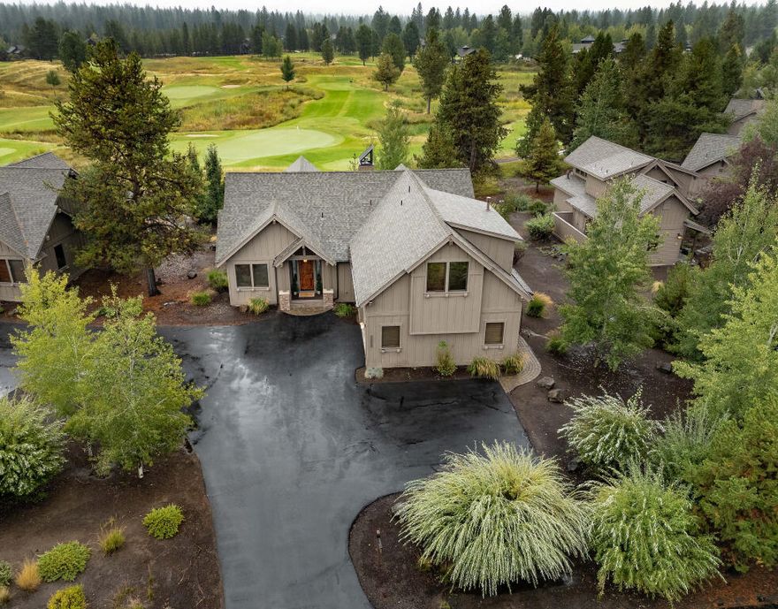 Escape to luxury in this rare Caldera Springs golf-frontage cabin! Offering 4 bedrooms and 5 full baths in 2,635 well appointed square feet, this retreat blends high-end design with pure vacation fun. Three main-level suites, a den, and a upstairs bunk and bonus room create space for everyone. Gather in the sunshine streamed great room featuring vaulted ceilings, a dramatic stone fireplace, exposed beams, and built-in cabinetry, or create culinary delights in the gourmet kitchen with slab granite countertops, knotty alder cabinetry, and a custom copper hood. Step outside to your private patio paradise—complete with hot tub and fire pit—perfect for après-golf cocktails or stargazing nights. Beautifully furnished and turn-key, with a 2-car garage, ample storage, and strong rental history. Just steps to the Lake House and close to all Caldera amenities. Subject to 38-week rental availability deed restriction; not for use as a full-time residence. Family traditions begin here!