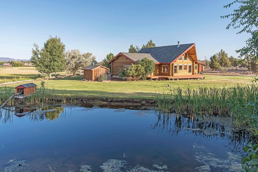 Back on market; no fault of the sellers. Price Reduced! Gorgeous custom Swedish Cope hand scribed log home on 5 acres w/ a pond for irrigation and incredible views. This property would make a wonderful equestrian facility. This immaculate home is 2219sf with 3br/2.5ba and a large loft. Insulated 48x48 shop w/pellet stove and high ceilings. 2.48 acres of irrigation for hay. Paved circular driveway and additional outbuilding for firewood storage. 4 bay machinery parking undercover at side of shop.