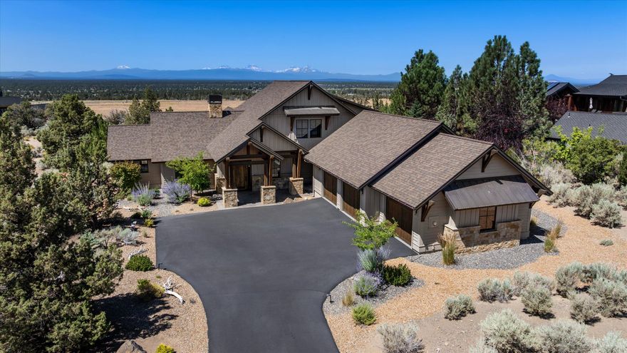 Stellar, Northwest style home with unfettered views of the Cascade Mountains. Inside this exquisite home, you will find an open plan living space with a kitchen perfectly designed for entertaining with its expansive island for gathering, an office, and an open concept great room with a fireplace accompanied by custom built-ins, rising to meet the wood beamed ceiling, that will lead you outdoors to the stone firepit where stunning views of the Cascade Mountains await. Rich and sturdy beams accentuate a spacious covered patio and lends itself to an uncompromised outdoor living experience here at Brasada Ranch. The primary bedroom is on the main floor with a spacious walk-in closet and a spacious primary bathroom. On the second floor, there are two additional bedrooms each with their own ensuite bathrooms. An oversized three car garage offers plenty of storage possibilities and completes this ideal home.