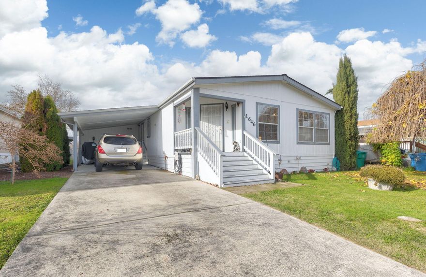 The home is located on a large lot within a manufactured home subdivision. This is NOT a 55+ park. Well-kept double-wide home with a bright and airy kitchen, large living room and master bedroom. The carport has a shed/shop at the back and are attached to the home. Has GPID irrigation available and is paid for by the owners of the land/subdivision. Large fenced backyard. Monthly park space is only $515 plus sewer (amount $48/month). The park pays for the water which is a community well.