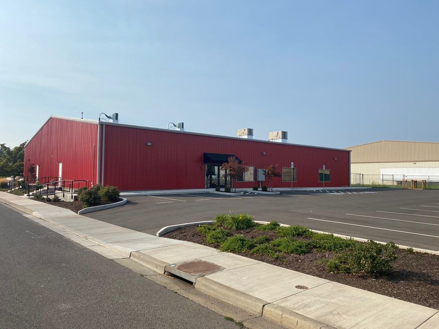 Incredibly nice, well appointed industrial building now available!  Built in 2017 the building is 100% climate controlled with heat and air, with very nice interior finishes including a commercial kitchen (excluding a hood system).  Well insulated with LED lighting throughout, office space, roll-up door and more!  Situated on a large 0.97 acre lot  for potential future expansion or spacious outdoor yard area.  Seller is open to leasing to a well-qualified tenant on a long-term lease as well.