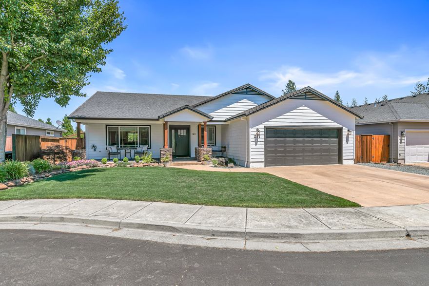 Discover the perfect blend of comfort and style in this beautifully remodeled single-level home, ideally located on a quiet cul-de-sac near a park and just minutes from Eagle Point Golf Course. This move-in ready residence has been thoughtfully updated throughout, featuring an open-concept layout that highlights a spacious kitchen with a large center island, quartz countertops, a stylish tile backsplash, soft-close cabinetry, a farmhouse sink, walk-in pantry, and stainless-steel appliances—including a wine and beverage refrigerator. Custom lighting, vaulted ceilings with a decorative beam, a modern gas fireplace, and high-quality laminate and tile flooring. The primary suite provides a serene retreat with a soaring ceiling, custom double-sink vanity, a beautifully tiled walk-in shower w/dual shower heads, oversized walk-in closet with built-in shelving. Enjoy the beautiful landscaped, fenced yard, water feature, covered patio and front porch. Newer roof, fencing, paint and HVAC.