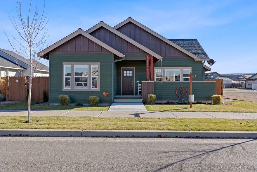 Beautiful custom Ironhorse home! Built with quality in mind, this 3 bed 2 bath home features an open floor plan with vaulted ceilings and cozy natural gas fireplace, walking into the very large open kitchen with hickory cabinets, granite countertops and convenient island with breakfast bar. Primary bedroom is separated from guest bedrooms and bath and has a very spacious walk in closet for lots of storage and beautiful tiled shower. The fenced side yard is cozy and requires very little maintenance. Lots of rock work and gravel lends to the ease of outdoor care. Alley access to attached double car garage and entry into home through utility room. This home boasts pride in workmanship and care and is move in ready, Located very close to Barnes Butte Elementary School and the new walking paths and recreational area.