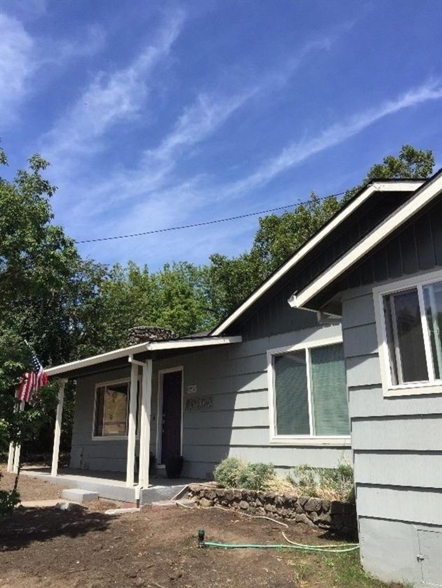 Let the pictures speak for themselves! Beautiful views, updated home! Flooring, paint windows, an amazing contrast to 1940! 4 bedroom and 2 full baths! 2.23 acres. Barn, workshop, and storage. Relax outside by the pond under the fruit trees! Also irrigated! You will love this home!!