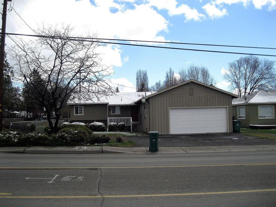 Nicely remodeled 3 bedroom home with 1.5 baths conveniently located in the Suburbs. Open concept kitchen features stainless steel & black appliances. Wood floors throughout. Updated bathrooms with new vanities, tile floors and tub surround. Bedroom closets include built-in drawers. Double-pane vinyl windows throughout. F/A gas furnace with A/C. Low maintenance yard. 2-car garage with paved driveway that passes through to Delaware Ave. Additional carport for extra parking.