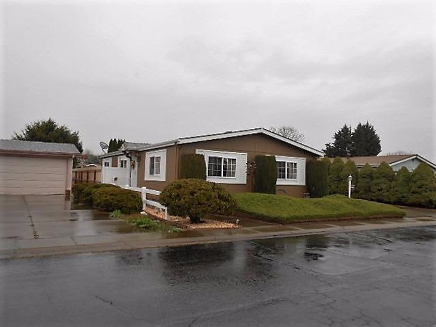 Beautifully updated, new granite counters, new engineered flooring, new kitchen cabinets, new stove, new carpet, and paint inside and out. Cathedral ceilings, new vinyl windows, new drapes. Updated bathrooms, granite counters, master has a walk in closet. Roof is three years old. This house shines!! The back yard is ample, with a covered patio, new fencing.