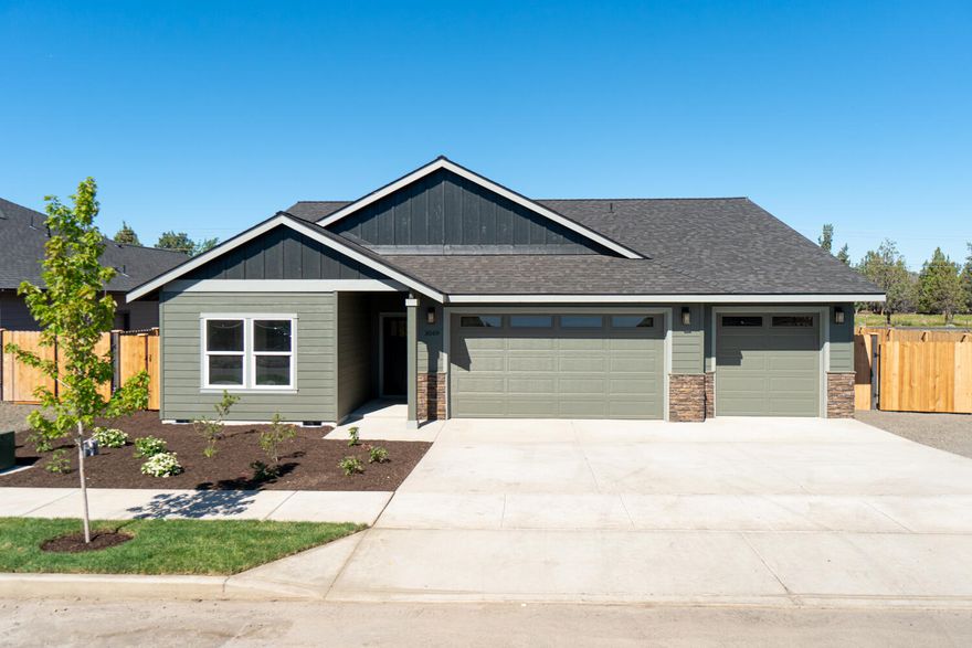 Don't miss this brand new build by Dunlap Fine Homes on the Bend side of Redmond. Enjoy spacious living both inside & out, w/plenty of room for entertaining plus an abundance of natural light throughout the home. Vaulted Great Room plan w/open concept style Kitchen boasts plenty of cabinetry & prep space on the slab Quartz counters. Neat & tidy full height tiled back splash, SS appliances & farm sink. Living space offers a cozy corner Gas burning fireplace w/stylish accents & room for gathering. Desirable Primary bedroom separation, walk in closet, step in shower, tiled floors & dual vanities. Flex space or office off the primary as well plus 2 additional guest rooms over off the entry w/full bath. Laundry room w/storage & folding table too! Durable wood look laminate flooring, carpet in bedrooms & tiled baths. Gas forced air, A/C & back patio. Triple garage, RV parking, fully fenced + landscaped w/auto sprinklers. There's still space in the back yard for a tiny home/ADU, workshop!