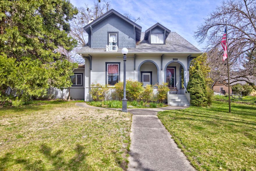 Charming early 1900s Victorian Cottage, nestled in the heart of Northwest Grants Pass. This home features beautiful craftsmanship that you will not find in modern homes. It has been well maintained throughout the years. It has 4 bedrooms, 2 bathrooms and is just over 2000 square feet. It has a detached two car garage and a car port. The property is a larger property at one-third of an acre. This is a must see and will make a great home for its next owner!