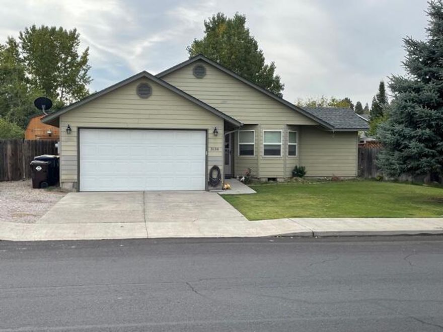 Truly a unique property located within the city limits.  The lot allows for a garden, chicken/duck area or dog run and two large storage buildings, large chicken coop, large deck and landscaped yard fenced with a sprinkler system.  There are cherry trees and berry bushes.  Large RV parking area.  Home is open floor plan, oversized master suite with its own ductless heating/cooling system.  The open living room also has a ductless heating/cooling system which is efficient and saves on your month heating bill.  All items in garage are being removed except the utility sink.