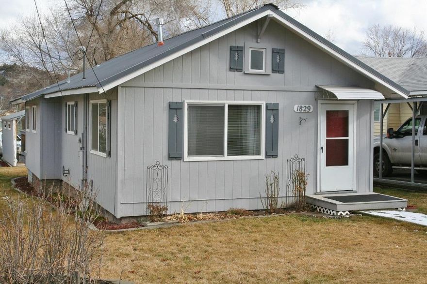 Super Cute, Super Clean, Tons of Updates & Great Curb Appeal! Darling inside & out 2 bedrooms 1 bath that is loved and cared for. Newer metal roof, attractive interior /exterior paint, updated lighting and interior doors, and even has a dining room and laundry room too. Easy care yard, charming deck, vinyl fencing, and carport make this a perfect first home! Hurry fast, this one is a keeper.