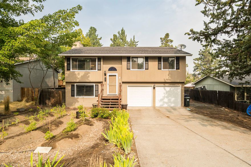 Looking for a house with a little extra space? Upstairs you find an open living floor plan with large windows that bring in the light. Being upstairs also provides great privacy.  A perfectly placed small gas fireplace keeps the home cozy. Also upstairs are three bedrooms, and one full bathroom. Downstairs you will find the second full bathroom which is generously sized and houses the laundry. A deep hall closet provides great storage. Need a TV room, home office, hobby haven, space to work out, or maybe an extra bedroom? The Large bonus room runs the full depth of the home and has great light. The garage is extra deep and has two independent garage doors.  Access your yard from the back decks off both the eating area and the bonus room. Yard has mature trees and great light for a plentiful vegetable garden.  Sellers have enjoyed the homes proximity to schools, restaurants and amenities.  Schedule your private showing today.