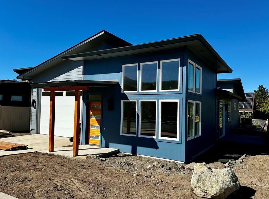 Comp Only Sale. 
Welcome to this beautiful, light filled home in the Beach Creek Net Zero community of Ashland! Built by KDA Homes, this 1438 sq. ft. residence offers 3 bedroom and 2 bathrooms thoughtfully designed for modern comfort and efficiency. Step inside and you'll find a smart, sing-level layout that makes the most of each inch. The living room features soaring 13 foot ceilings and expansive windows that fill the space with natural light while framing stunning mountain views.  The custom designed kitchen showcases granite countertops, detailed tile work, and a space island--perfect for functionality and entertaining. The primary suite offers a tranquil retreat with backyard access, a generous walk-in closet and luxurious bathroom. The garage includes an impressive 11 foot tall opening. Enjoy sustainable living and easy access to all that Ashland has to offer.