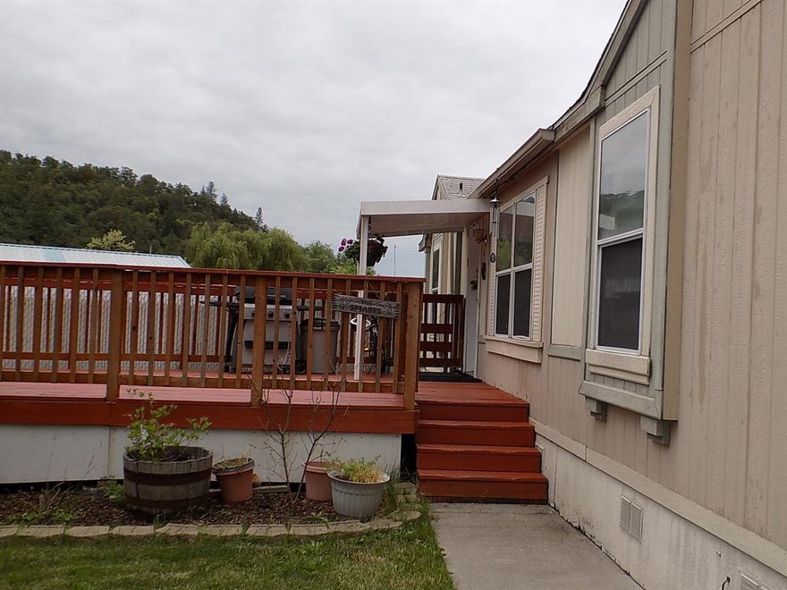 Located in Butte Creek Estates, this larger 1512 sqft home built in 2000 is situated in an excellent location in the park. It sits on a larger space located near Reese Creek Rd entrance. This home offers a split floor plan, vaulted ceilings, large open kitchen with an island, master suite has a nice big closet with two entrances. Seller has recently updated flooring and has fresh paint in most rooms. There is a pellet stove that helps with heating the home in the winter months. On a quiet evening you can hear Little Butte Creek rippling in the background from the spacious deck that is perfect for relaxing. There are raised garden beds and a fenced area for pet. The park offers a variety of activities and kid friendly functions through out the year for a great community feel.