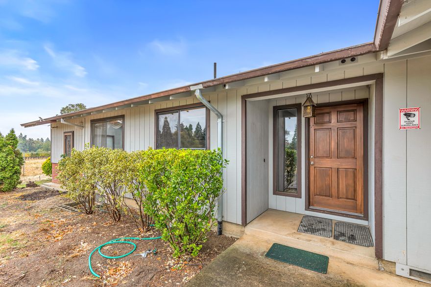 This is one of those rare opportunities, a one owner ranch style home, built 50 years ago. It features 3 bedroom, 2 bath with a great room and an office or family room area. The attached garage is 588 sq. ft. but wait, there is more. A separate shop is close by with 806 sq. ft. It has a 11 X 16 foot door and is 28 ft. deep. There is room for the RV plus room for that work shop you have always wanted. The property sets back from Camp Baker Rd. on its own driveway and has 2 fenced pastures for the horses. TID serves the property with water rights for 3+ acres.
