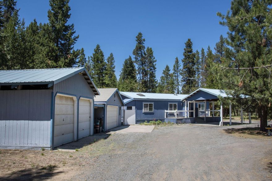 Great location just Â½ mile from LaPine State Park on a 1-acre lot. New exterior paint in 2023, metal roof, vaulted ceilings, tile entryway. Outbuildings include a 20' x 28' - 2 car detached garage/pole barn, 24'x 24' - 2 car detached garage with 11'x15' workshop & 220 electric. An additional 20'x20' attached carport with a metal roof. Level wooded lot, 56'x 113' x 6' high fenced and gated area for animals, circular driveway, fenced back yard, raised flower beds and 14' x 10' shed. The well-designed kitchen offers an island with breakfast bar, lots of cabinets and counterspace. Generous sized open living room, comfortable eating area. The primary suite features a vaulted ceiling, walk in closet and both bathrooms were updated in 2018. Covered 7'x 20' back deck/porch. Near Wickiup & Crane Prairie Reservoir, Sunriver, the Cascade Lakes Highway and all the fabulous recreation that Central Oregon has to offer.