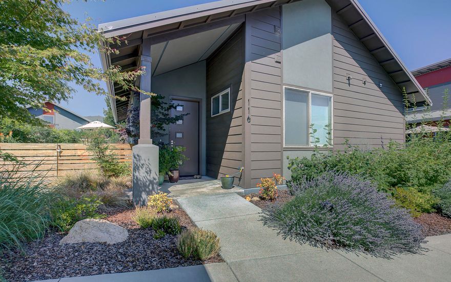 As you enter thru the custom front door you're struck by the lovely cork floors, the vaulted ceilings in the living room, and the amazing natural light coming in through the large windows. The living room has a natural flow to dining area and kitchen. The beautiful living room has a gas fireplace with a wonderfully carved wooden mantle. In the living room and dining area there are large windows looking out over the treed and flowered landscaped open space. There is extensive usage of custom blinds especially the up down style.The kitchen has high-end appliances, beautiful quartz countertops and tons of cabinets including corner storage cabinets with a rotating shelves for extra storage.  The bedrooms are in their own wing. The master bedroom has a walk-in closet and a luxurious bathroom with a walk in shower, and black out draperies. In addition, outside this amazing single level home is a double unit storage. There is also exclusive usage of your own raised garden bed.