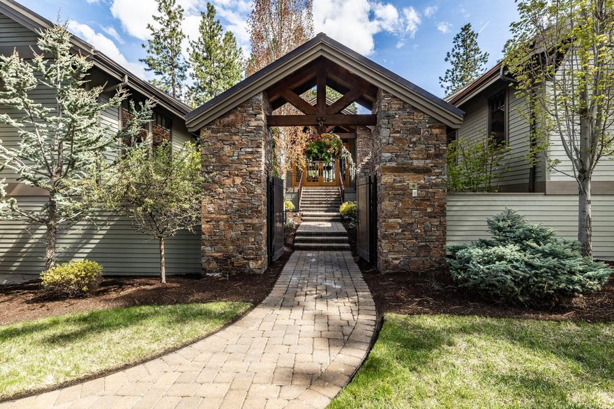 Nestled above Broken Top's 15th Fairway, this spectacular NW mountain lodge home presents breathtaking interiors that perfectly complement its awe-inspiring environment. Single level living floorplan embodies rustic elegance w/ generous rooms showcasing panoramic views & outdoor entertaining areas that inc dining & bbq patios, firepit, hot-tub patio & gated courtyard entry w/cascading waterfall & peaceful stream welcoming guests.  Designed around a flowing floorplan that provides luxe accommodations for guests & large-scale entertaining. Exceptional finishes thruout inc plank wood flooring, massive wooden beams & wood burning fireplace & encompass incredible kitchen w/ brkfst bar & adj. family room w/ fireplace. Media room provides perfect venue for hosting gatherings. Primary suite inc. fireplace, luxurious bath & large walk-in closet.  4 generously sized guest suites provide ample space for family & guests. 6+-car garage w/ 36 ft deep bay & wine cellar may be accessed via elevator