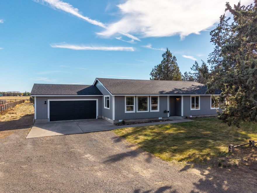 Located on a quiet paved road next to 85 acres of community park with direct access to public lands and Deschutes River Canyon recreation, this 1704 sq ft, move-in-ready, single-story, 3 bed/2 bath stick-built home offers balanced rural countryside living with residential comforts. Recent 2025 upgrades—new roof, new interior/exterior paint, new energy efficient windows, and new light fixtures—mean fewer future expenses. Enjoy a water-conscious front and back lawn, a fenced backyard with patio, and over an acre of flat land-perfect for adding outbuildings or bringing in your horses. The attached 2-car garage adds weather-safe practicality. Become part of the Crooked River Ranch community, featuring a year-round golf course, pickleball, summer pool, community groups, and stunning river canyons with mountain views all around.