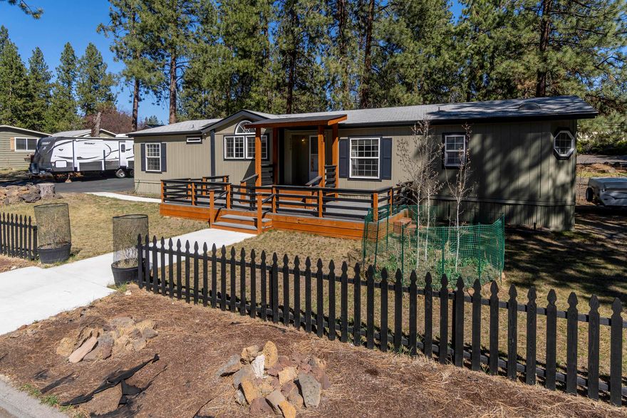 Nestled in the pines of Romaine Village situated on a corner lot is this wonderful home hooked to city sewer & Avion Water.  Centrally located to the Riverwalk Trail along the Deschutes River, Amphitheater, Old Mill District & an abundance of restaurants to choose from. 3 bd plus office, 2 ba, dining rm, open great rm & spacious kitchen w/ cabinets galore.  Master Suite has large walk-in closet, soaking tub, separate shower & dual vanities.  Guest bedrooms are on opposite side of home allowing complete privacy.  Don't miss the separate Art Studio in back & 3 Garden shed.  Enjoy outdoor entertaining either on the front deck or backyard on your massive deck with extensive use of pavers.  The huge yard is completely fenced w/ plenty of room to park an RV.    2 car garage is detached w/ plenty of space for all your toys.  1500 sf paved driveway, compacted gravel for RV/Boat parking.  Option to enjoy the amenities of Romaine Village w/ pool, playground & clubhouse, you will have to join.